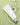 A skincare product bottle in water with a calming green background.