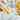 Close-up of test tubes with yellow  and clear Acetyl Tetrapeptide-2 liquid on a light background