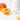 Apricot with a skincare dropper and serum on a white background