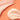 Close-up of smooth cream on an orange background