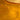 Close-up of amber liquid honey with bubbles on a gold background