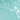 Close-up of clear liquid on a light blue background