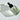 Glass dropper bottle with black cap on a light gray background
